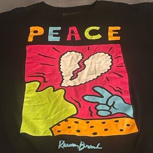 Reason Black Tee with Colorful Peace Graphic